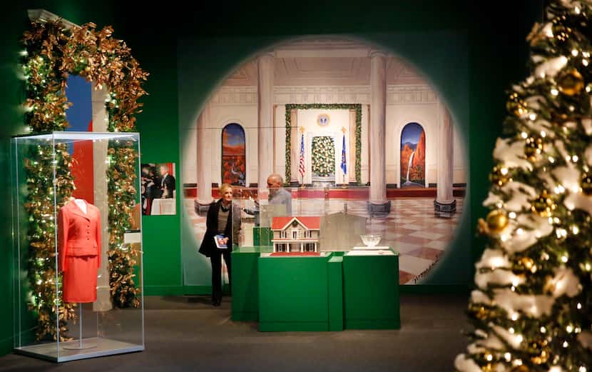 Visitors peruse the Holiday in the National Parks exhibit at the George W. Bush Presidential...