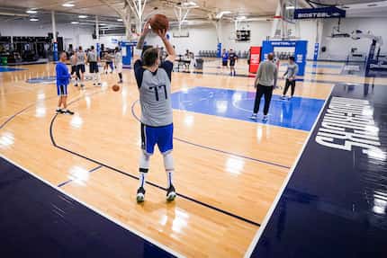 Dallas Mavericks guard Luka Doncic takes a 3-point shot as the team practices in preparation...