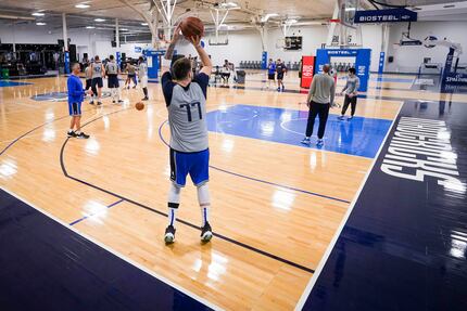 Dallas Mavericks guard Luka Doncic takes a 3-point shot as the team practices in preparation...