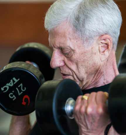 Bill Vick, who has pulmonary fibrosis, lifts weights at Carpenter Park Recreation Center in...
