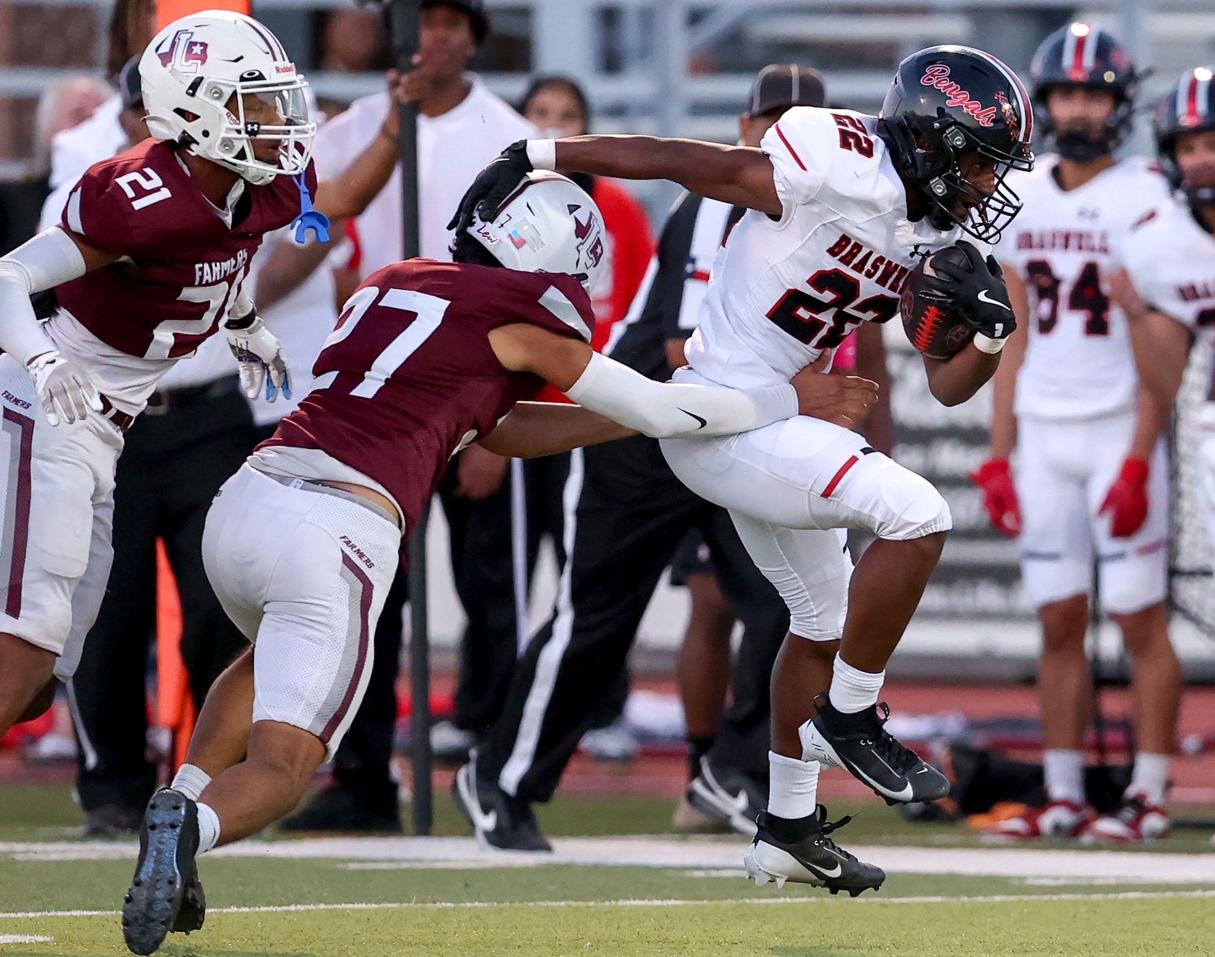 Denton Braswell running back Zahir Trufant (22) fights for yardage against Lewisville...