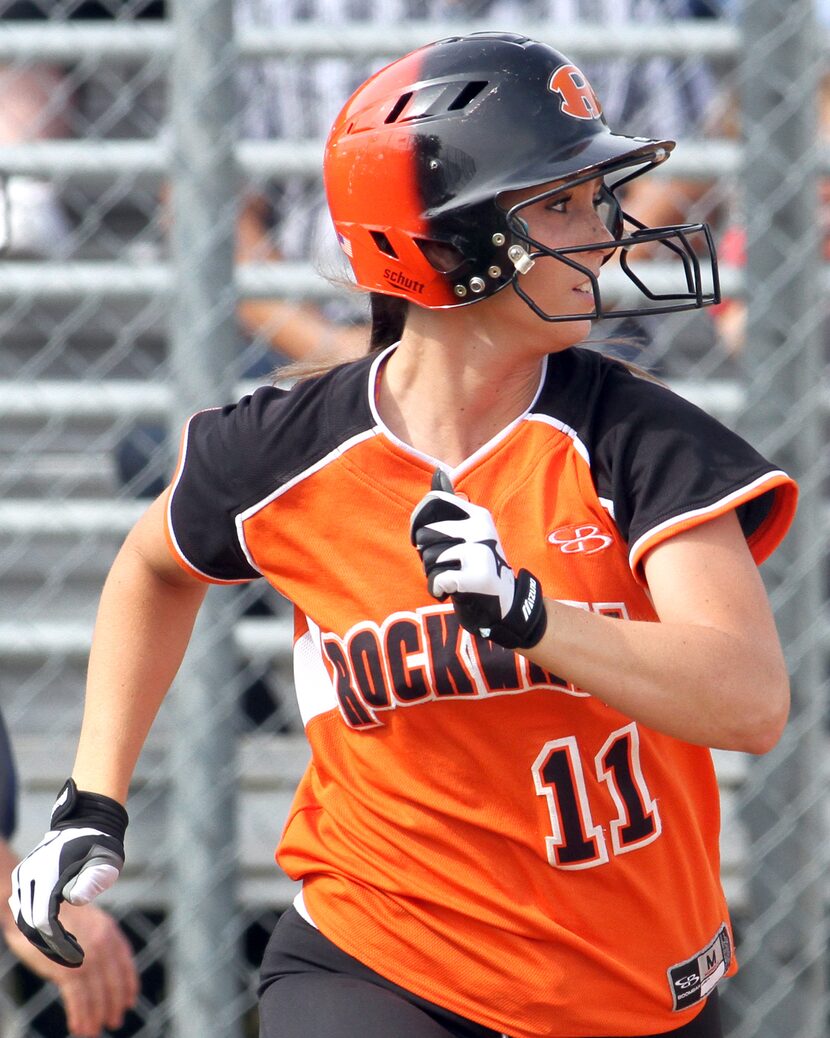 Rockwall's Jocelyn Myers (11) watches as her long towering drive cleared the fence for a...