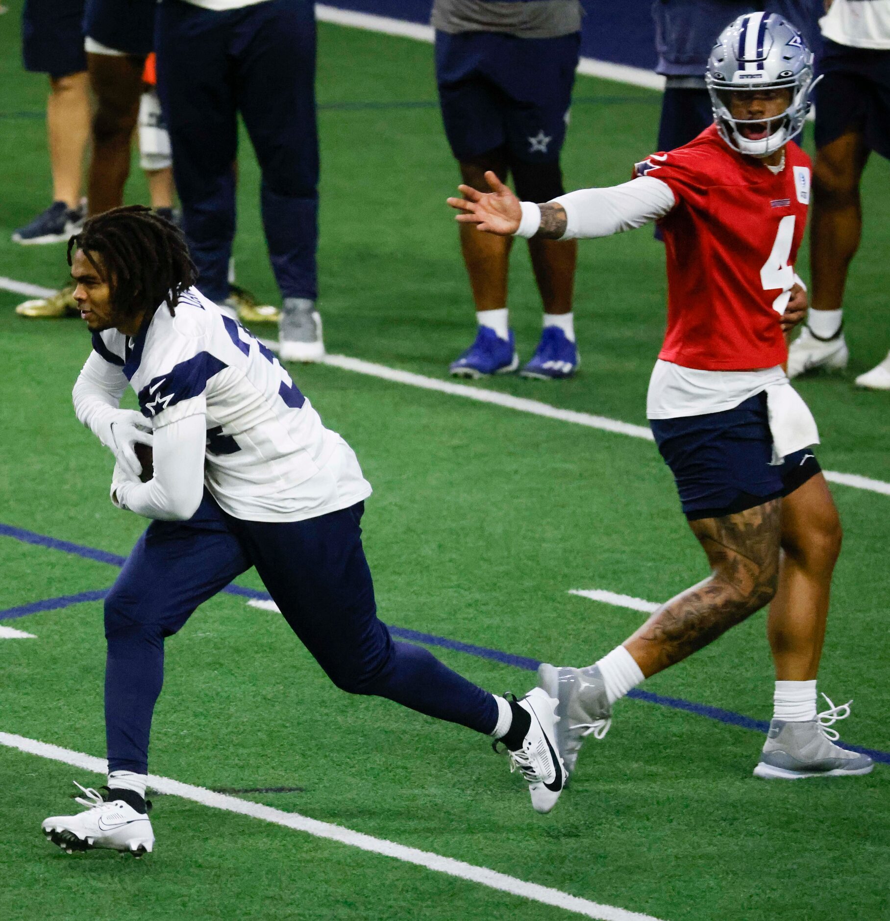 Dallas Cowboys quarterback Dak Prescott (4) hands off the ball to Dallas Cowboys running...