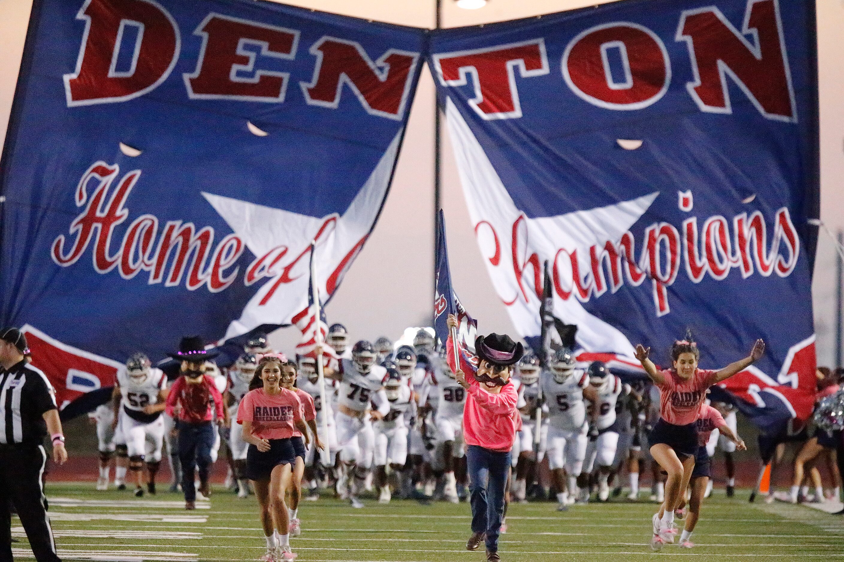 Denton Ryan takes the field before kickoff as Frisco Heritage High School hosted Denton Ryan...