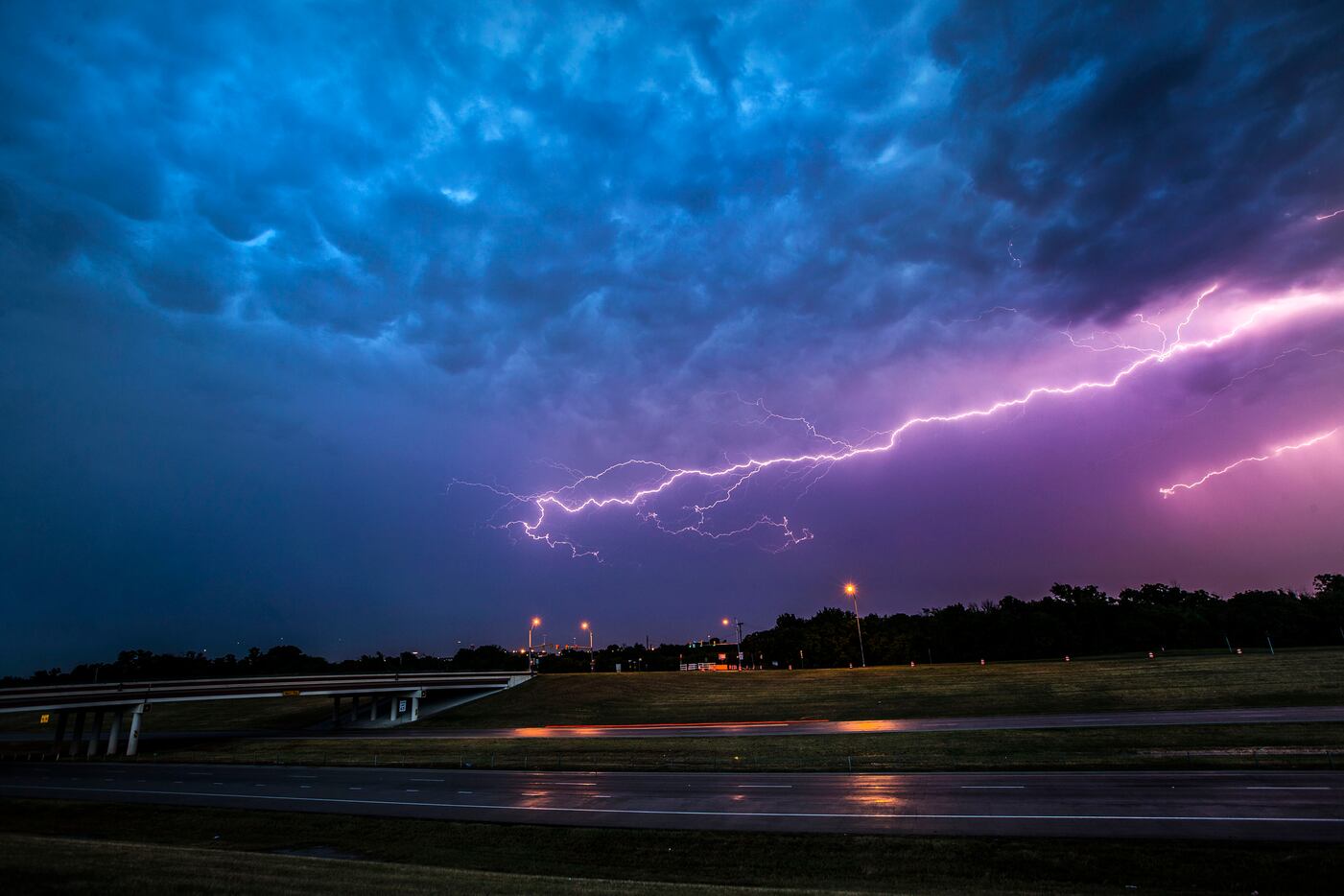 Lightning bolts fill the sky over highway 360 near Euless, Texas on Friday, June 2, 2017....