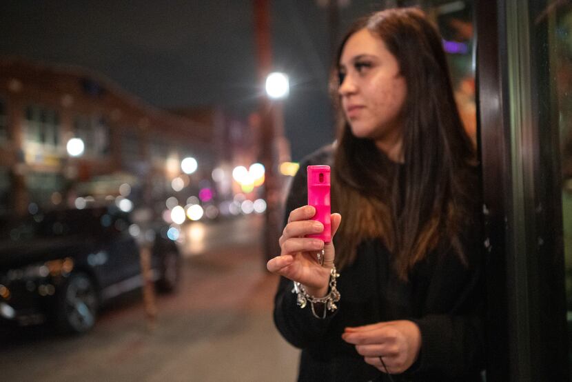 Restaurant manager Seryna Fagan, 18, poses with a canister of pepper spay she carries for...
