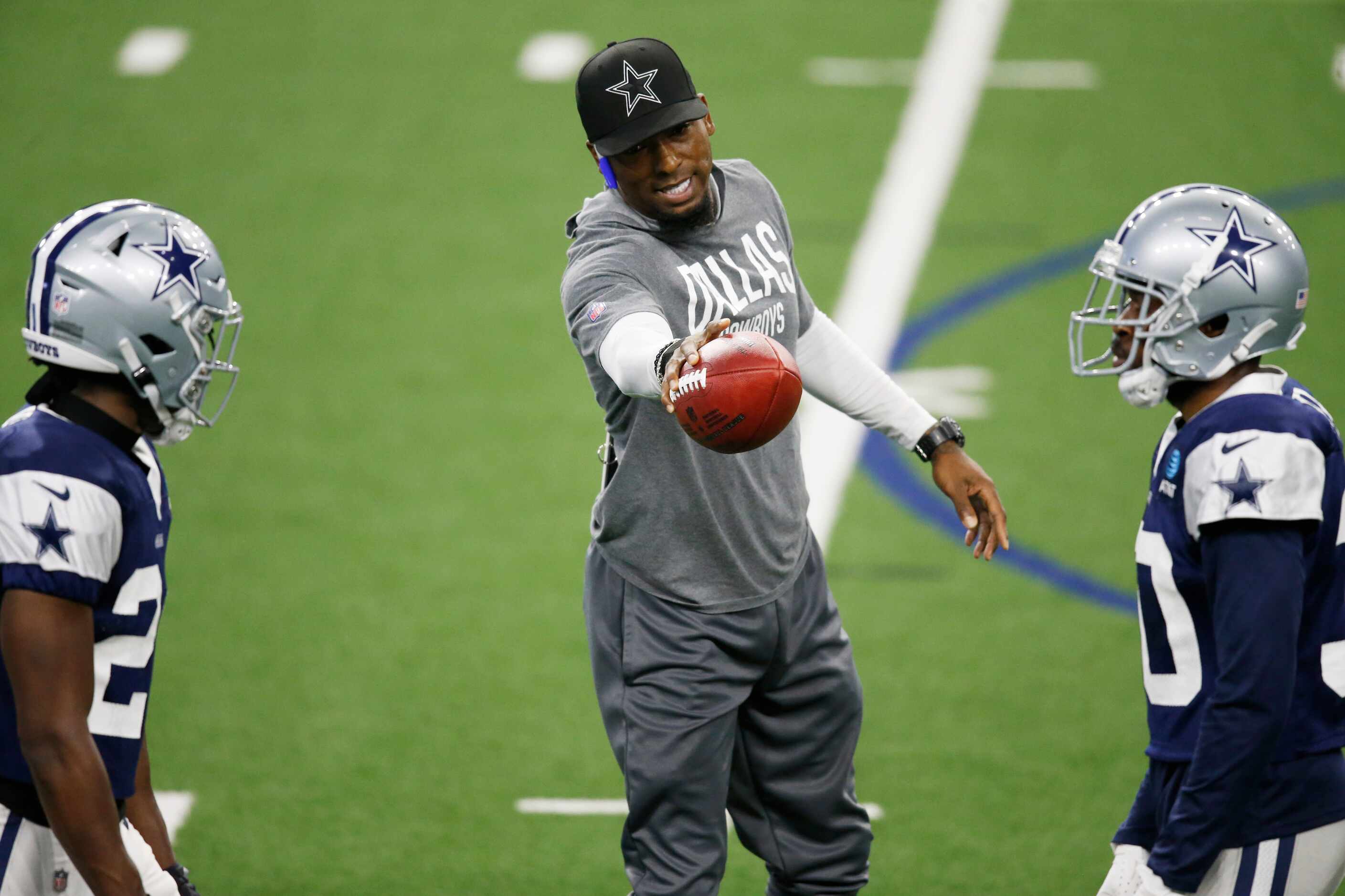 Dallas Cowboys defensive backs coach Al Harris instructs Dallas Cowboys cornerback Chidobe...