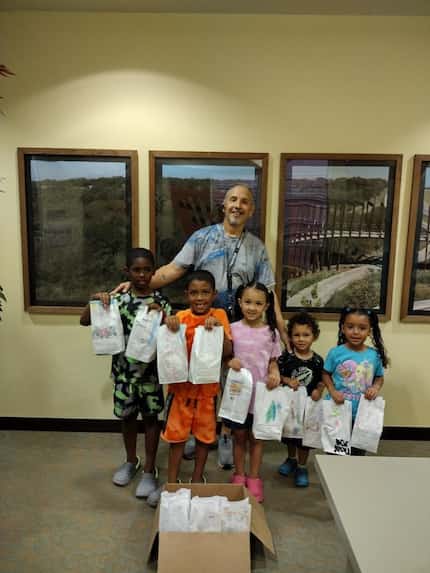 Dennis Benavides, with his five children. Benavides is a single dad that found community...