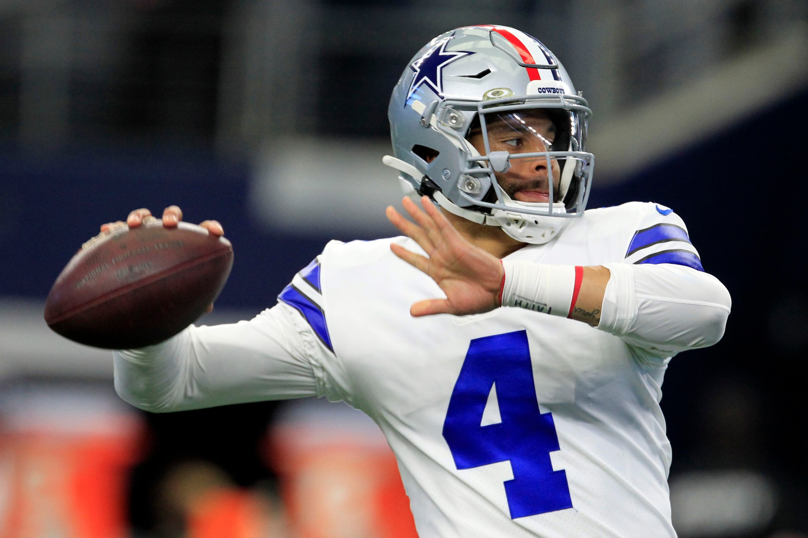 Dallas Cowboys quarterback Dak Prescott (4) throws a pass during pre-game workouts before...