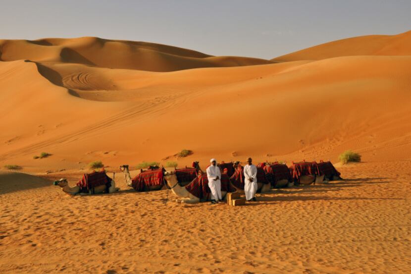 Dunes rise over valleys in the Liwa Desert, part of the world's largest uninterrupted sand...