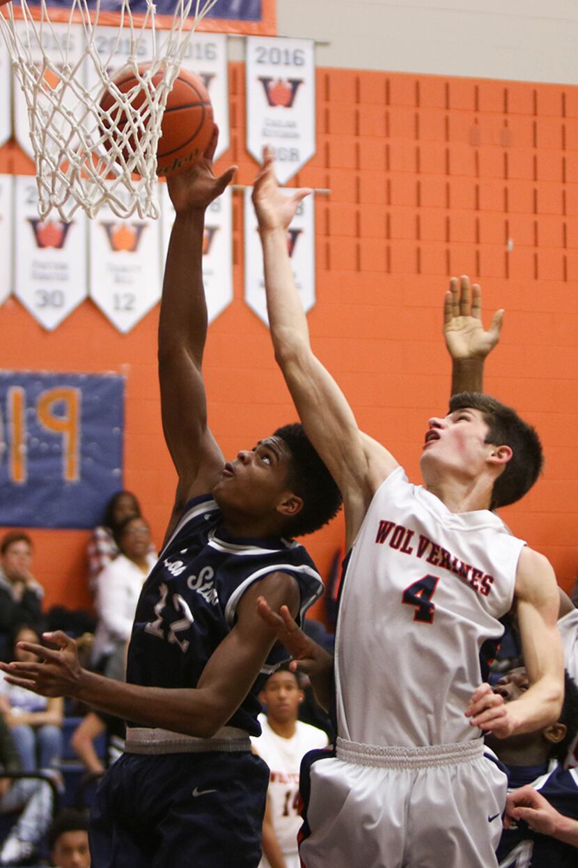  Lone Star High School guard Greg Rob (12) attempts to block a shot from Wakeland High...