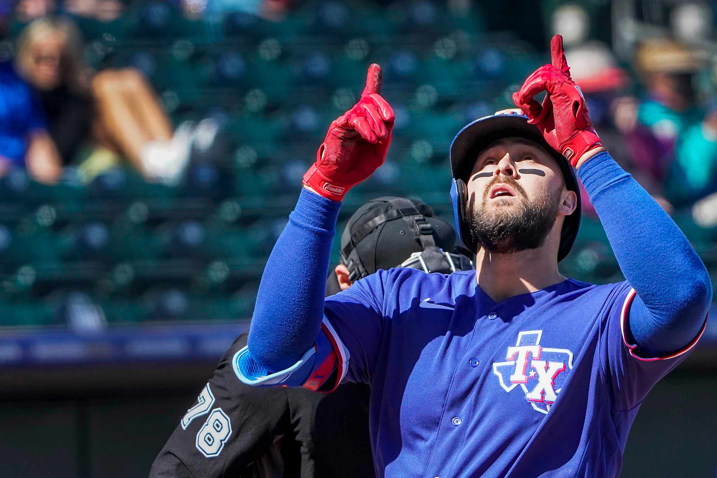 Texas Rangers outfielder Joey Gallo celebrates  after hitting a 2-run home run during the...