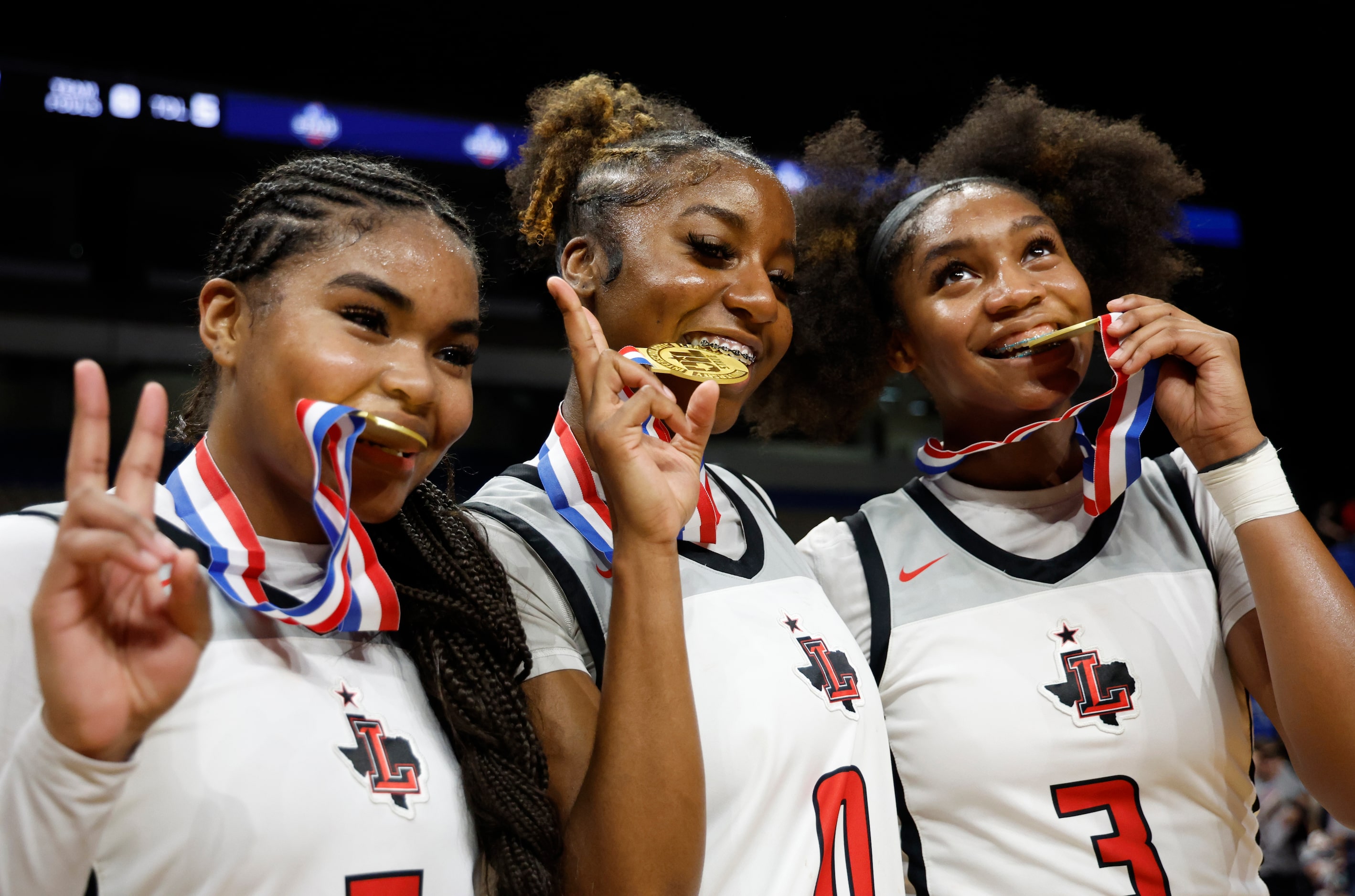 Frisco Liberty's Keyera Roseby (5), Aziyah Farrier (0), and Jacy Abii (3) pose for...