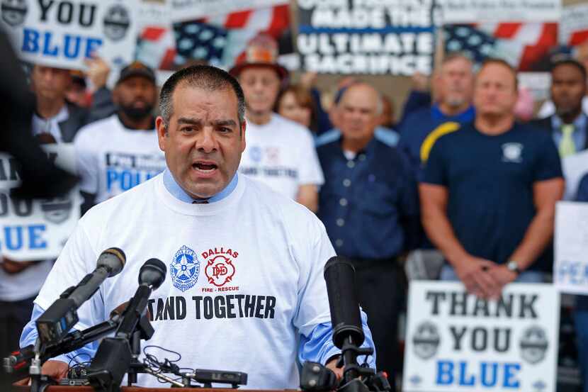 Michael Mata, president of Dallas Police Association, speaks during a rally at the City Hall...