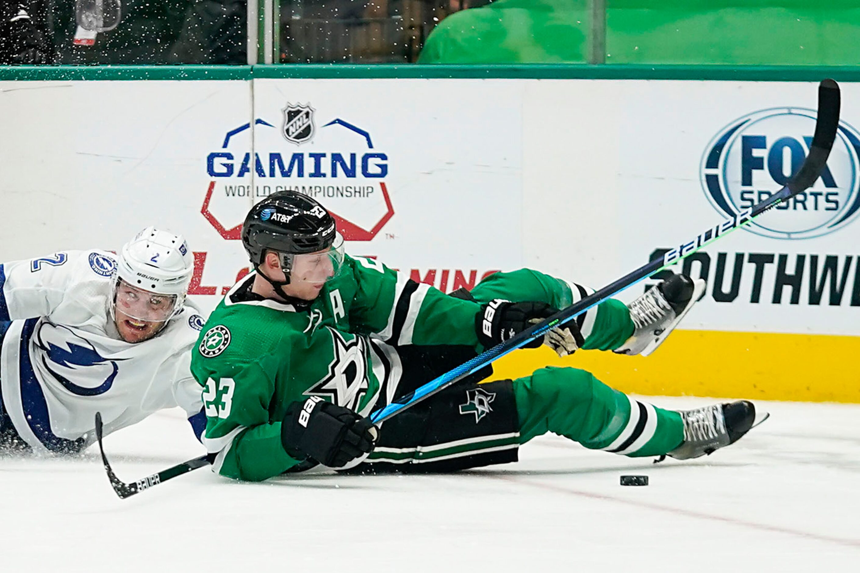 Dallas Stars defenseman Esa Lindell (23) fights for the puck against Tampa Bay Lightning...