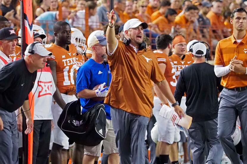 Texas head coach Tom Herman directs his team to accept a penalty during the first half of an...
