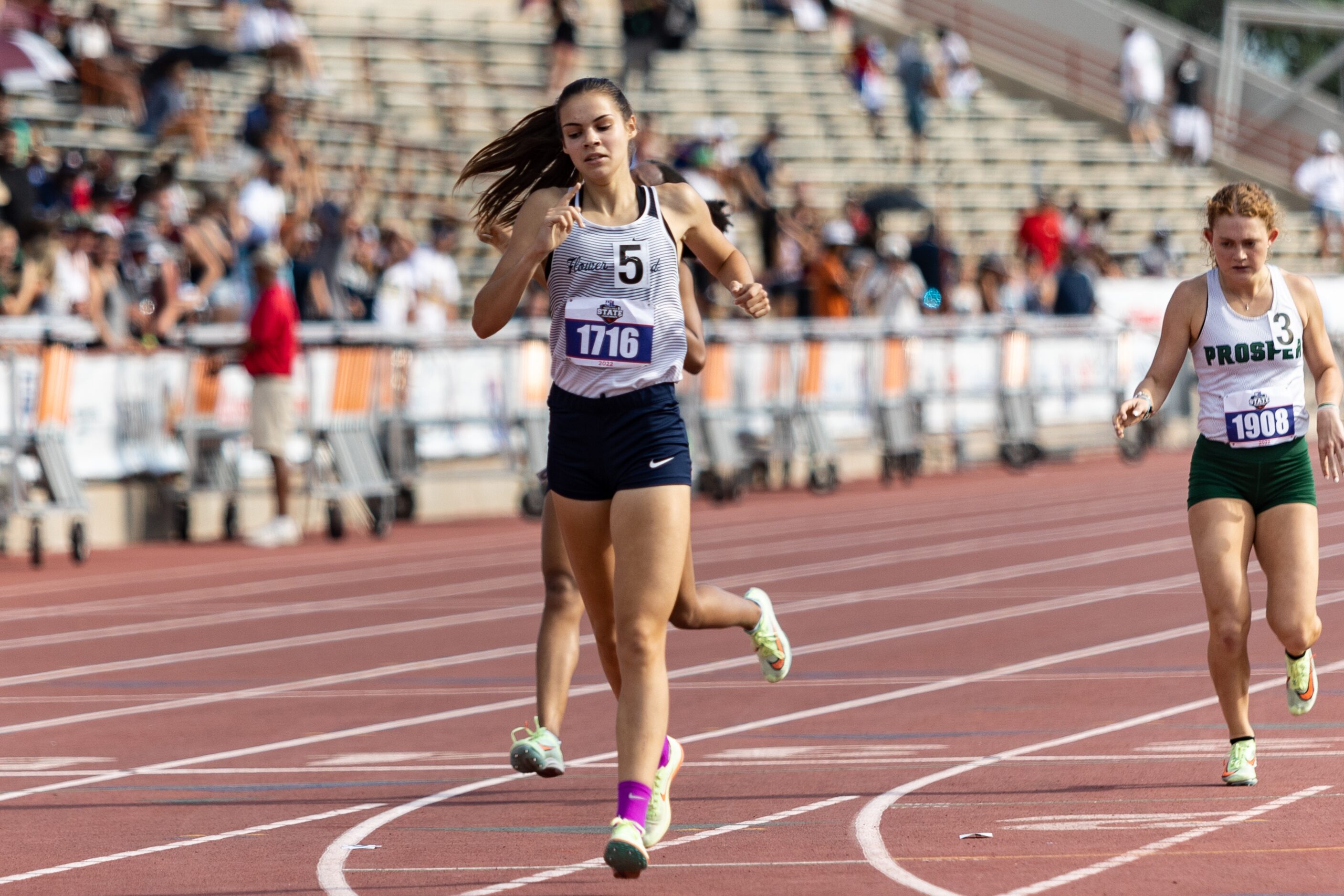 Samantha Humphries of Flower Mound reacts after finishing first in the girls’ 800-meter...