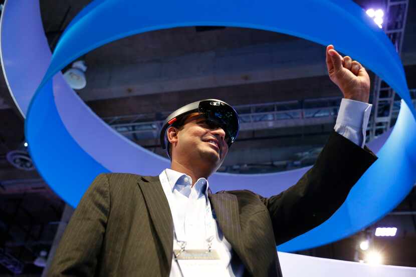 SaiGanesh Gopal uses Microsoft Hololens wearable holographic computer during The Summit for...