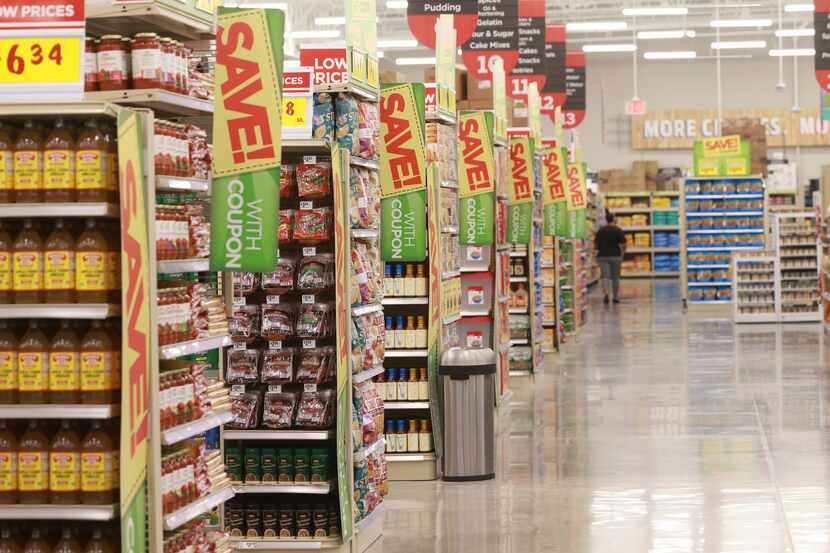 Rows of grocery aisles inside the new H-E-B in Plano. The company's Frisco store opened...