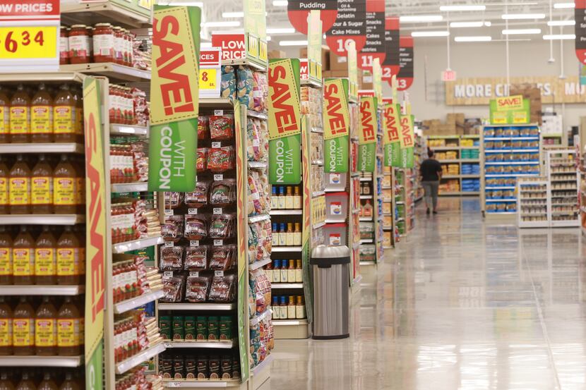Rows of grocery aisles inside the new H-E-B in Plano. The company's Frisco store opened...