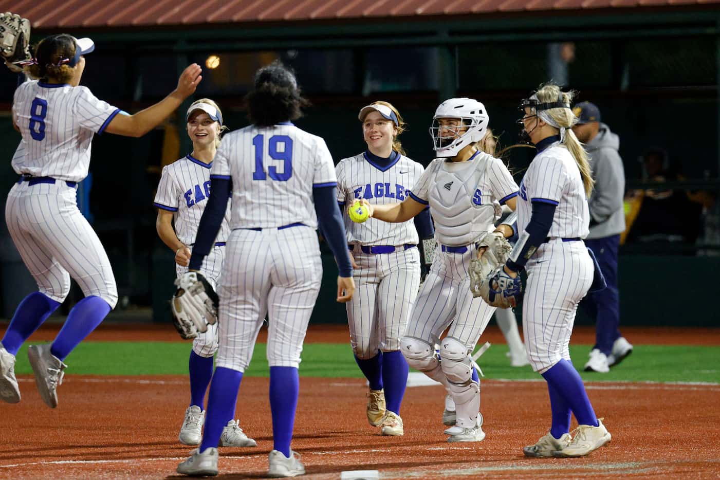  Allen players celebrate after they made McKinney's Ryley Oles (15) out at first during the...