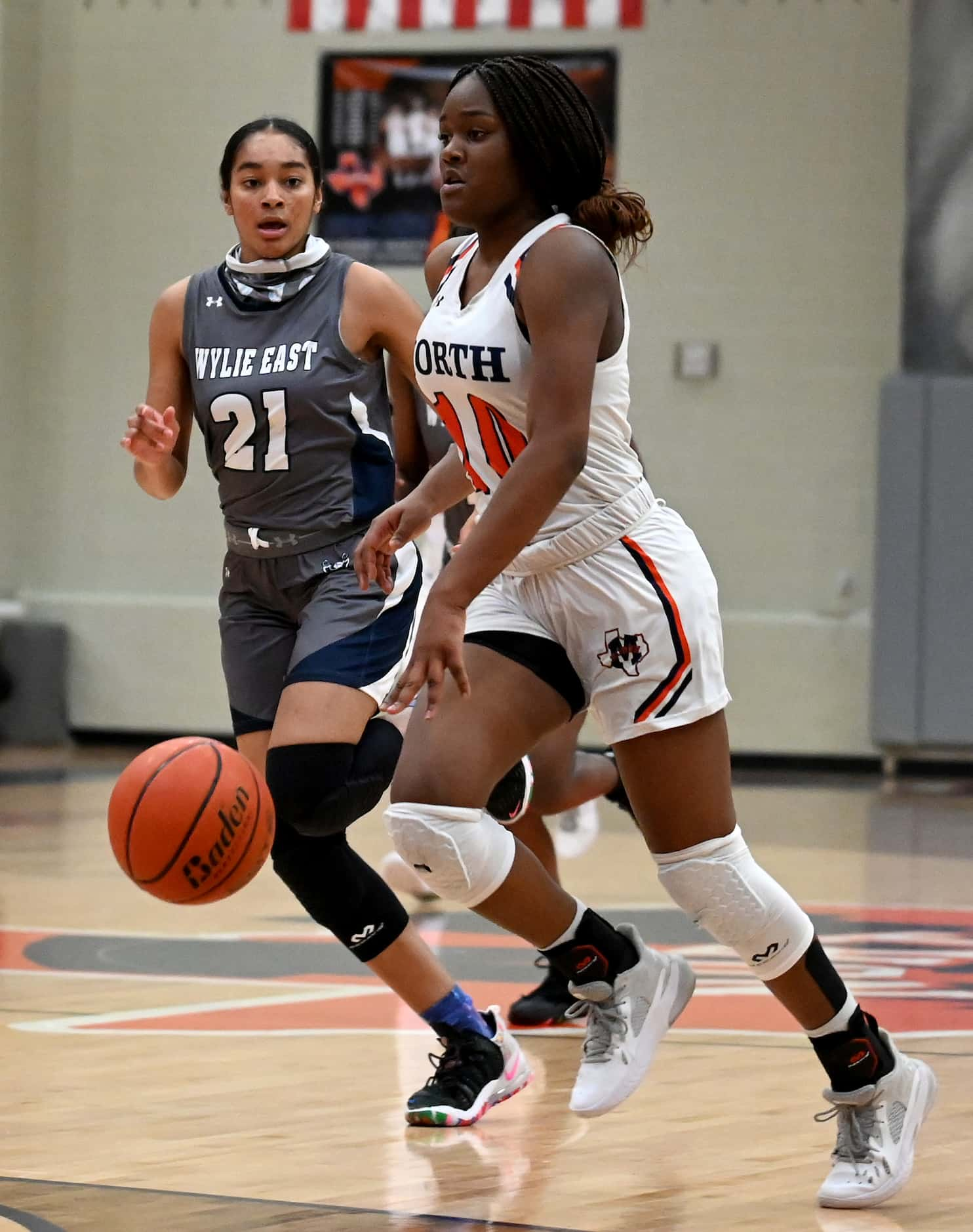 McKinney North’s Kaelyn Hamilton (10) brings the ball upcourt in the first half during a...