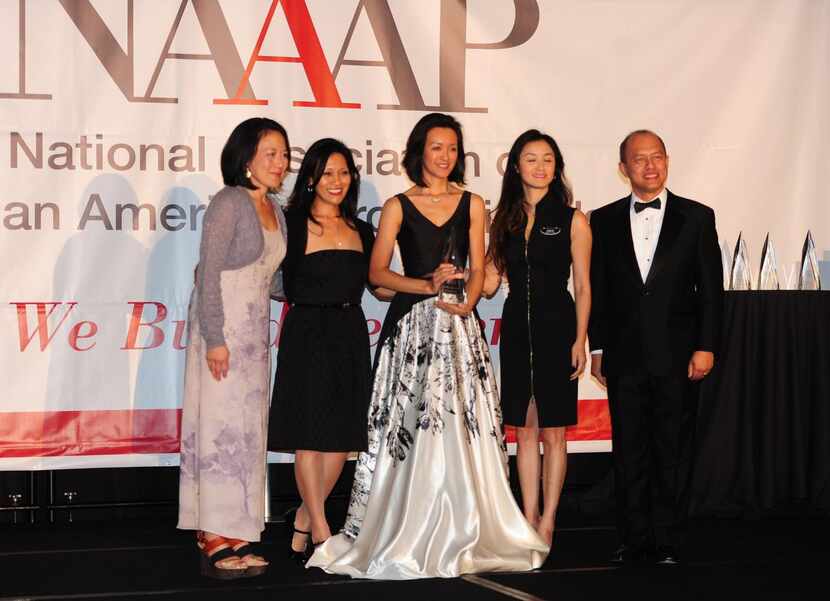 
Tammy Nguyen Lee (center) received the NAAAP 100 Award at the NAAAP Convention Gala at the...