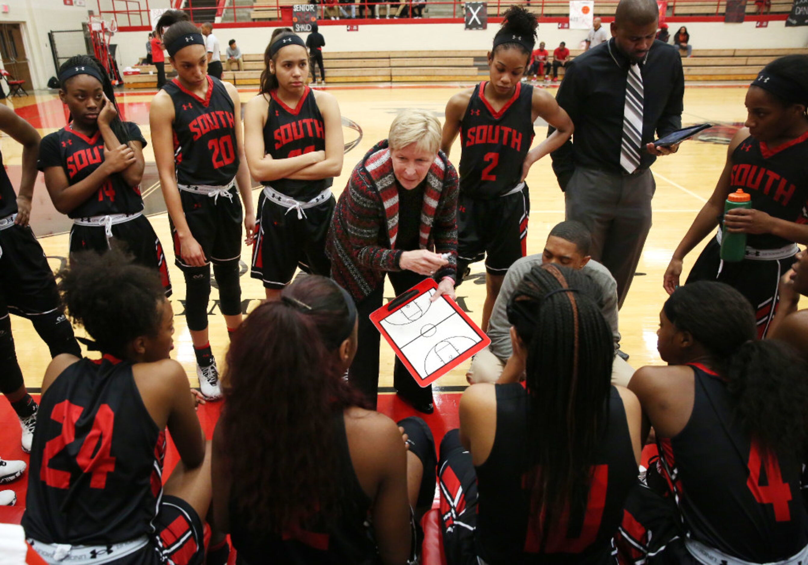 South Grand Prairie coach Samantha Morrow talks to her team during the first quarter against...