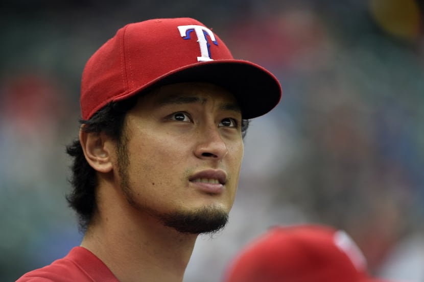 Texas Rangers starting pitcher Yu Darvish (11) watches the team play the Detroit Tigers...