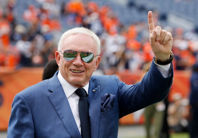 Dallas Cowboys owner and general manager Jerry Jones waves to the fans before a game between...