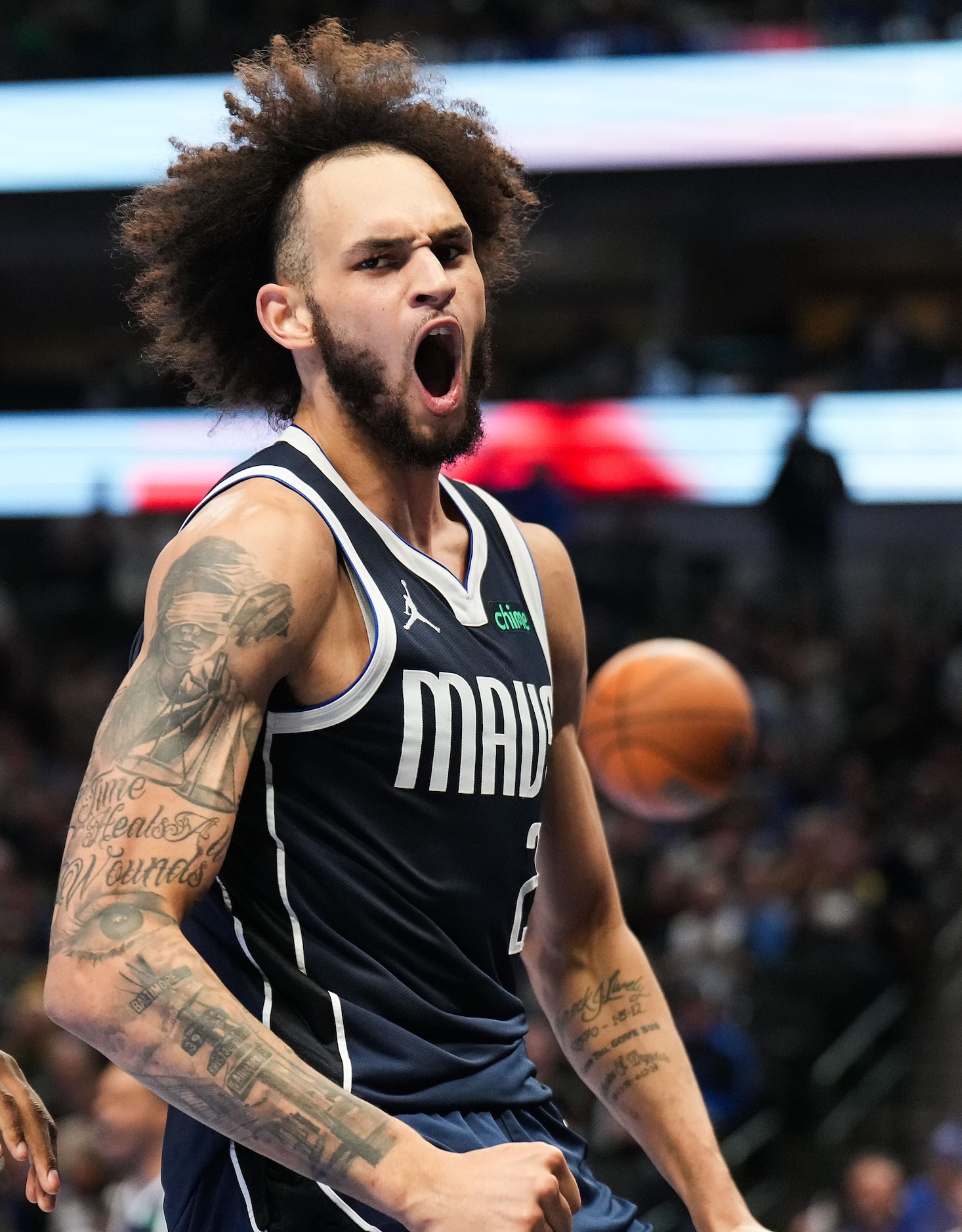 Dallas Mavericks center Dereck Lively II celebrates after a dunk during the first half of an...