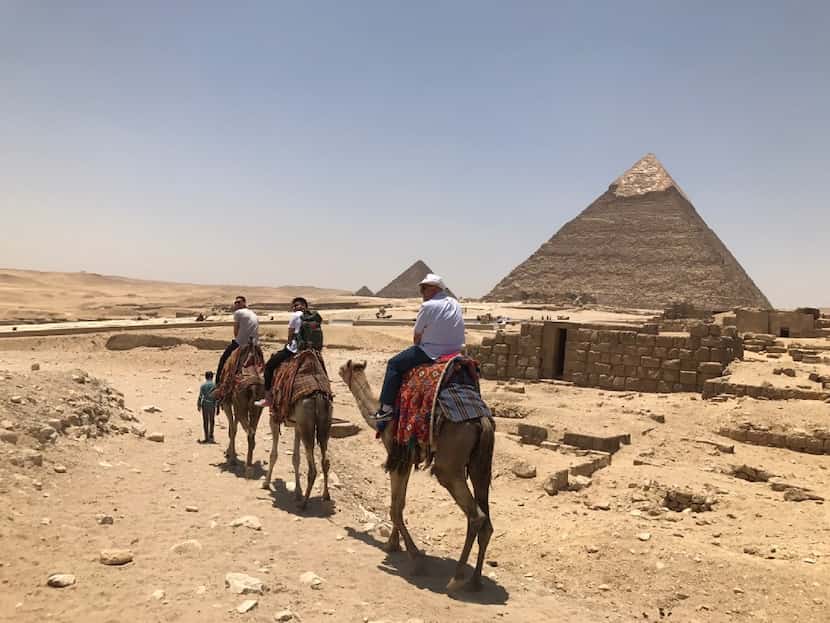 Dallas Mavericks forward Dwight Powell leads his group on a camel tour of Egyptian pyramids...
