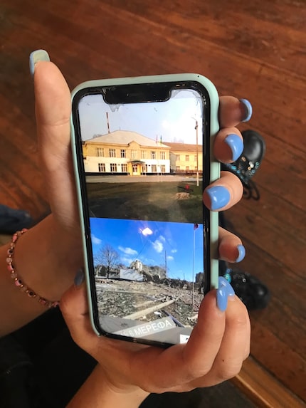 Ana Saprykina, a Ukrainian living in the Dallas area, shows a photo of her school in before...