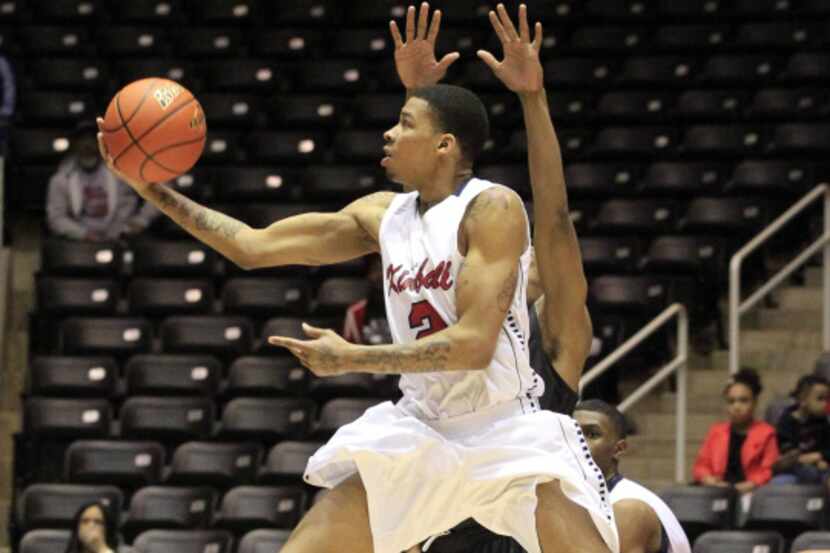 Kimball High's Keith Frazier (2) shoots the winning shot during the final seconds of an UIL...