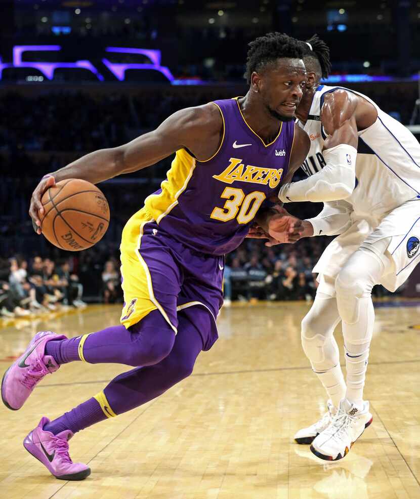 Los Angeles Lakers forward Julius Randle (30) drives past Dallas Mavericks' Nerlens Noel (3)...