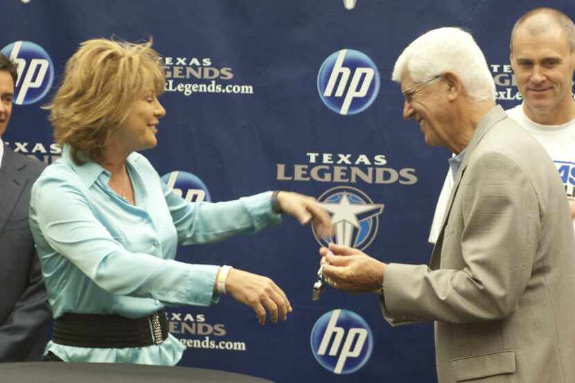 Coaching legend Del Harris, here getting the Texas Legends' head-coaching whistle from Nancy...