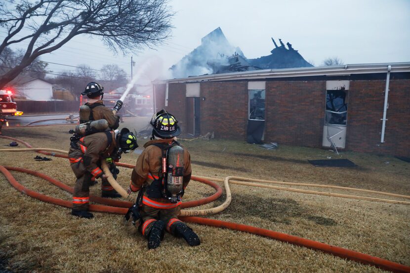 Irving firefighters respond to an early-morning three-alarm fire at Bear Creek Community...