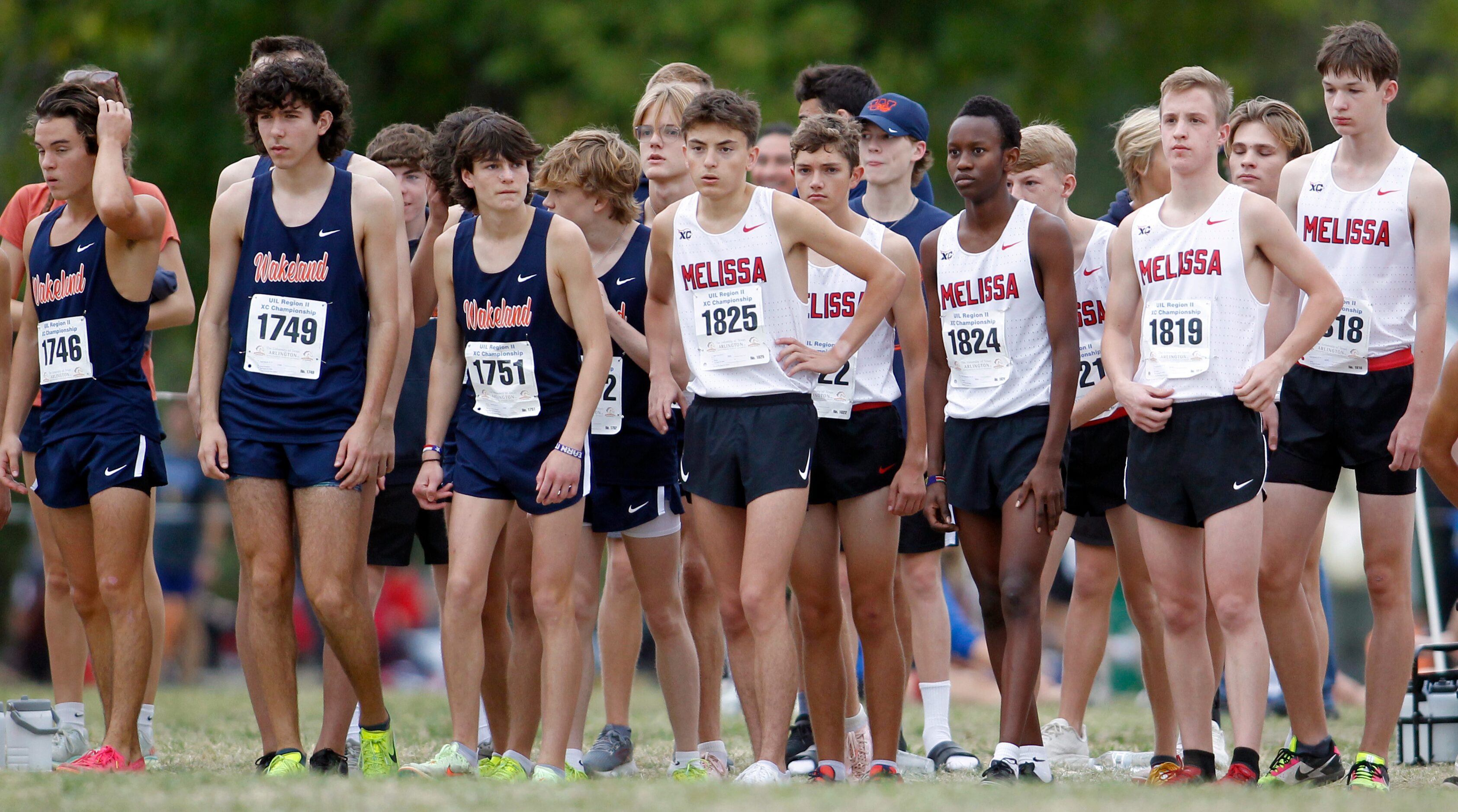 Members of the Frisco Wakeland and Melissa boys teams await the start of the Class 5A,...