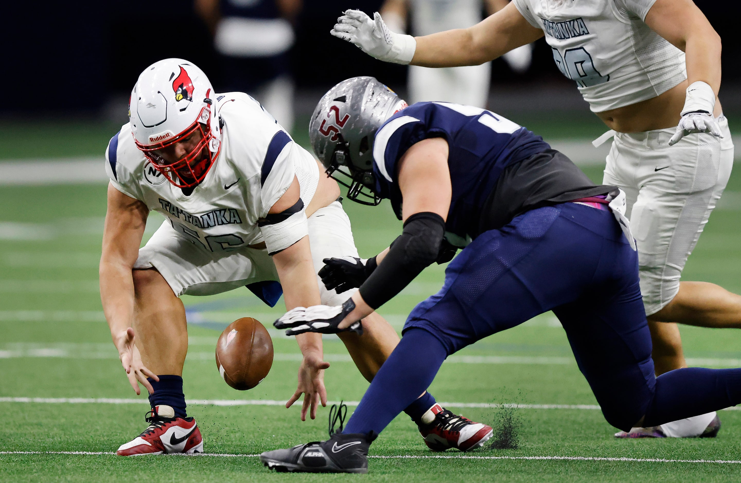 Ta’ Tanka’s Christopher Goodman (56) recovers a fumble as he dives for the football with...