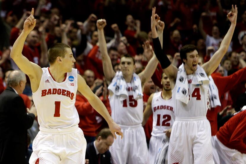 Ben Brust #1 of the Wisconsin Badgers celebrates a three point shot in the second half...