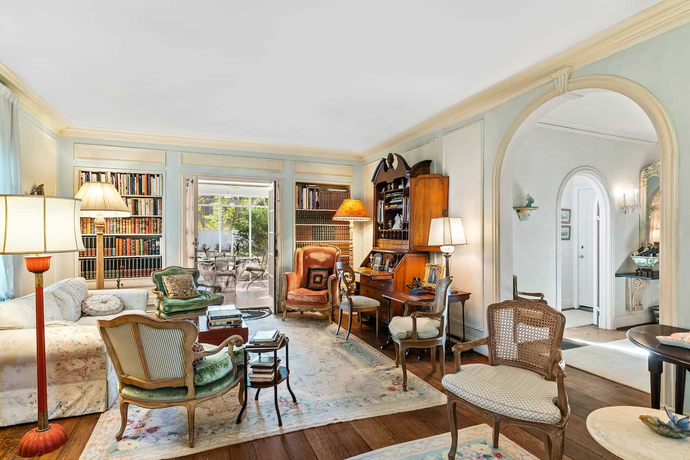 In the formal living room, elegant moldings and trim work elevate the space.