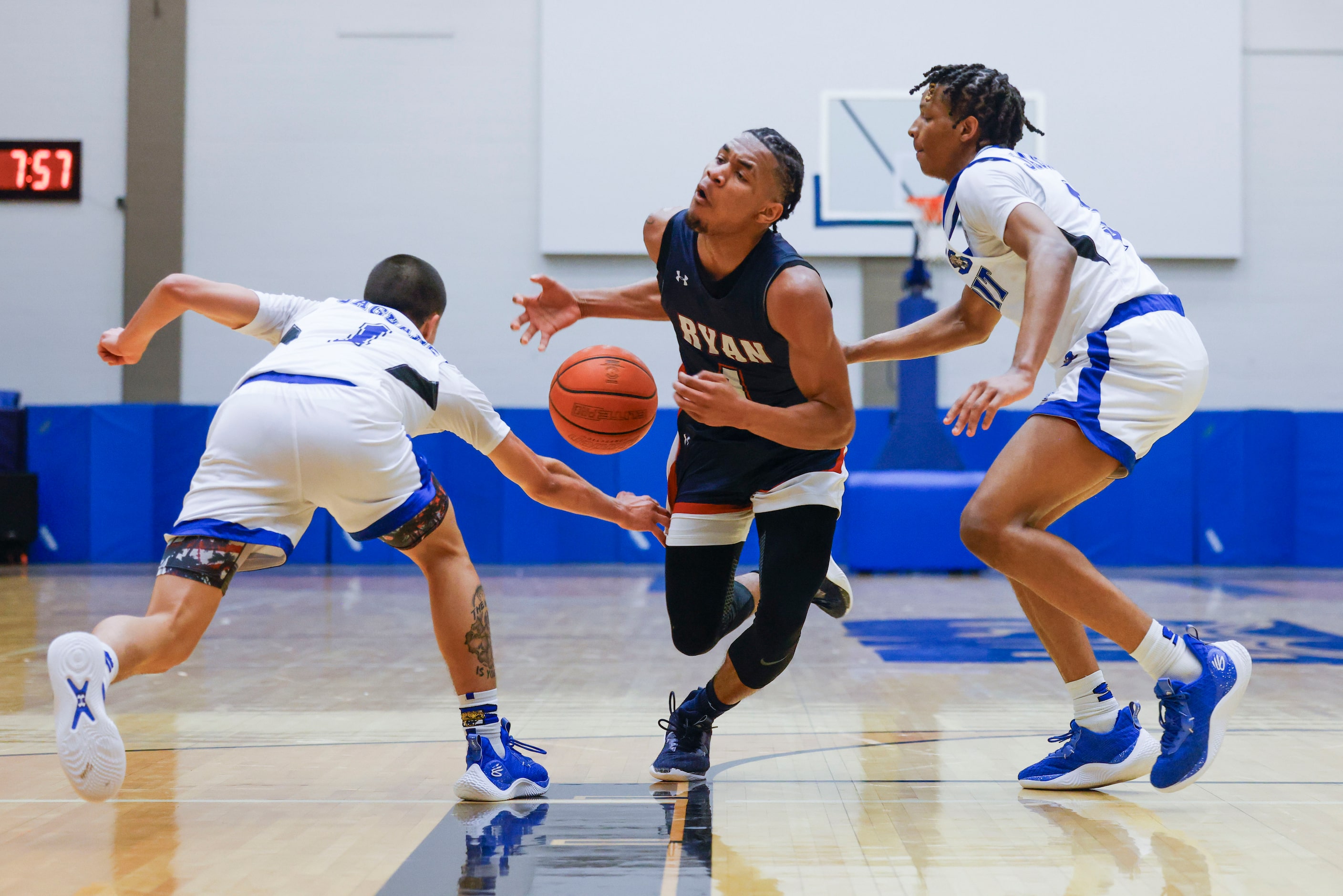 Mansfield Summit’s Theo Brannan (left) takes the ball away from Denton Ryan’s Cedric Dent...