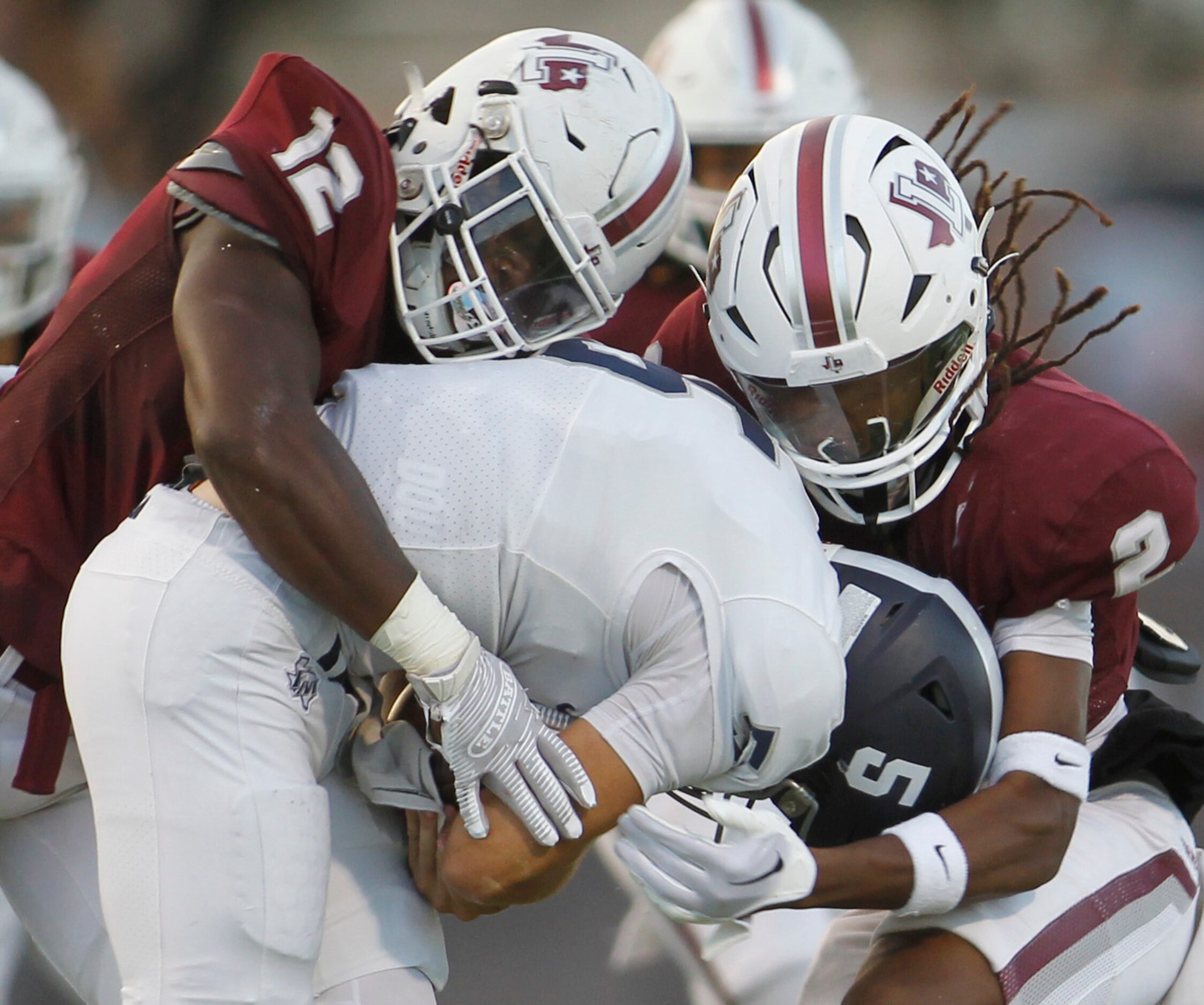 Flower Mound quarterback Jake Watson (5) is stopped at the line of scrimmage by Lewisville...