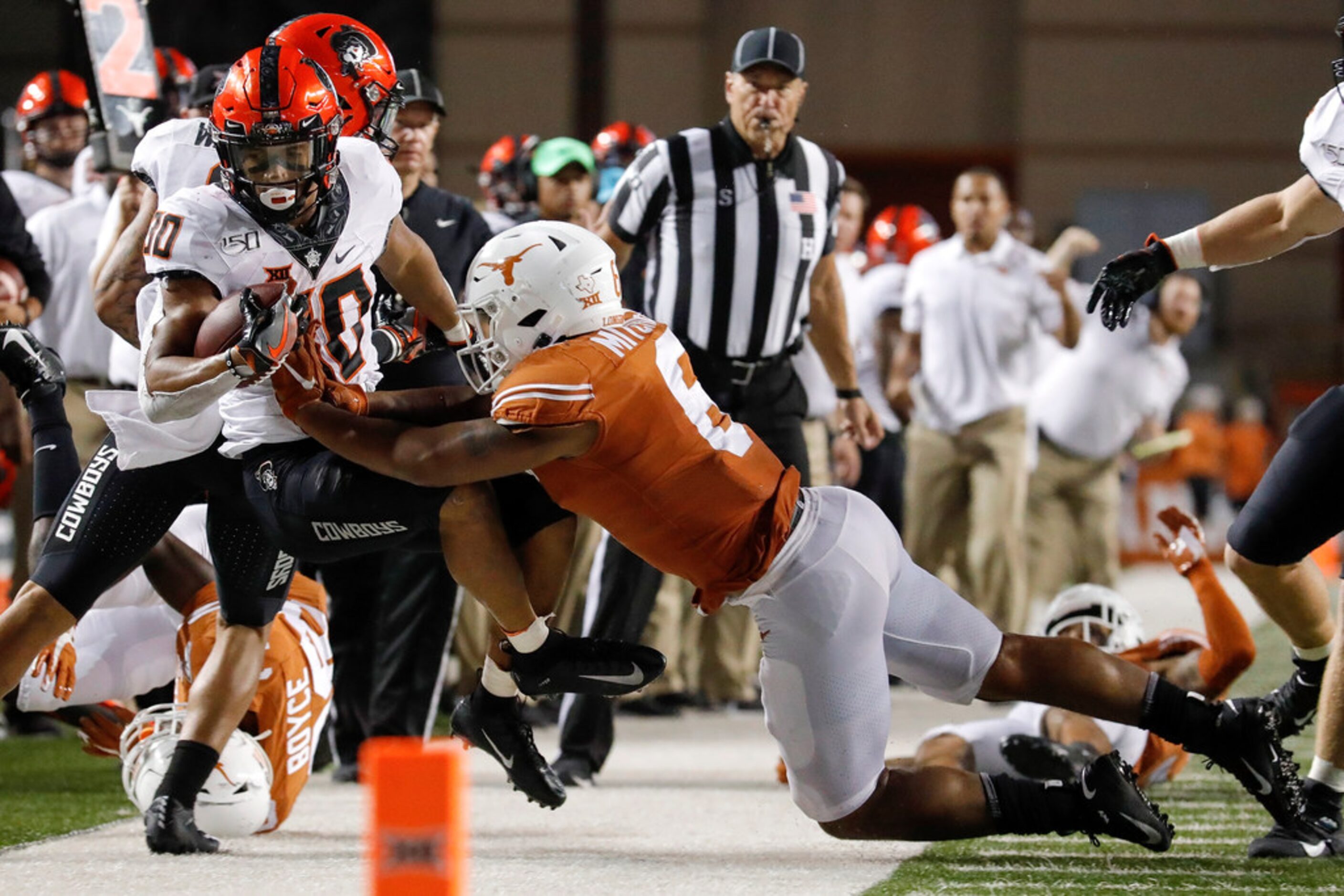 AUSTIN, TX - SEPTEMBER 21:  Chuba Hubbard #30 of the Oklahoma State Cowboys is forced out of...