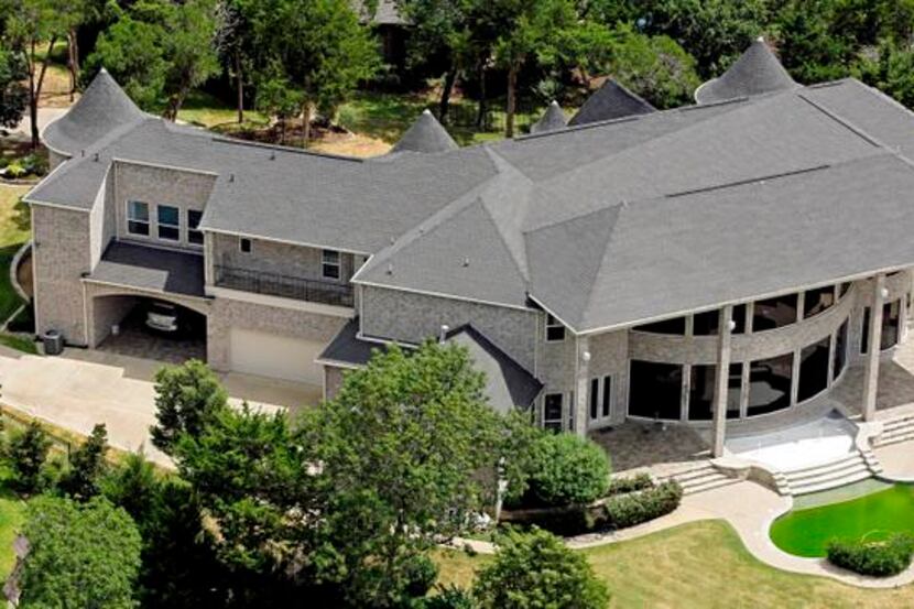 
An aerial photo shot last summer shows a Cedar Hill home belonging to hospital chain owner...