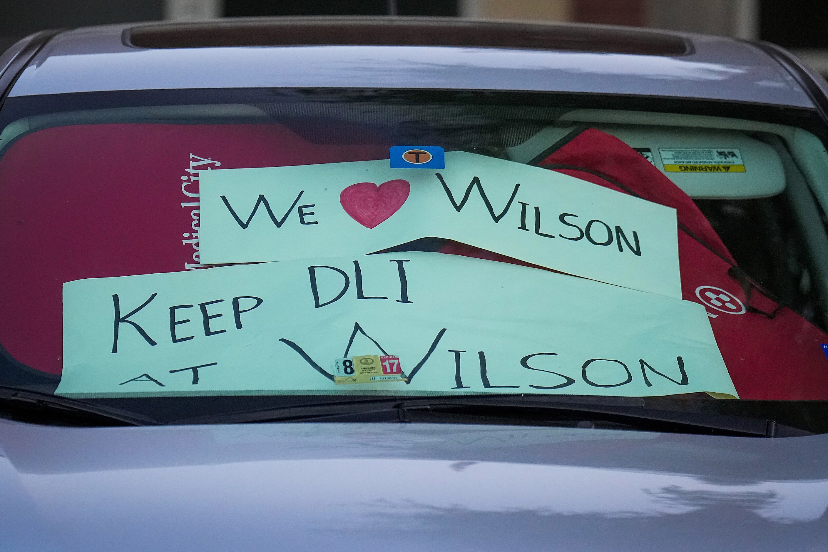 Sings in a car in the parking lot show support for keeping the Dual Language Immersion (DLI)...