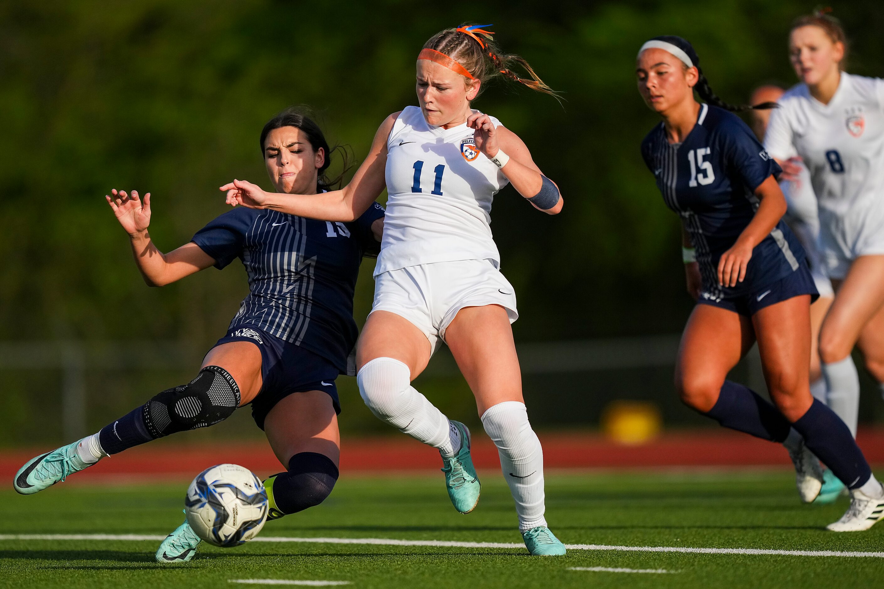 Prosper Walnut Grove midfielder Gianna Wilbur (13) challenges Frisco Wakeland defender LG...