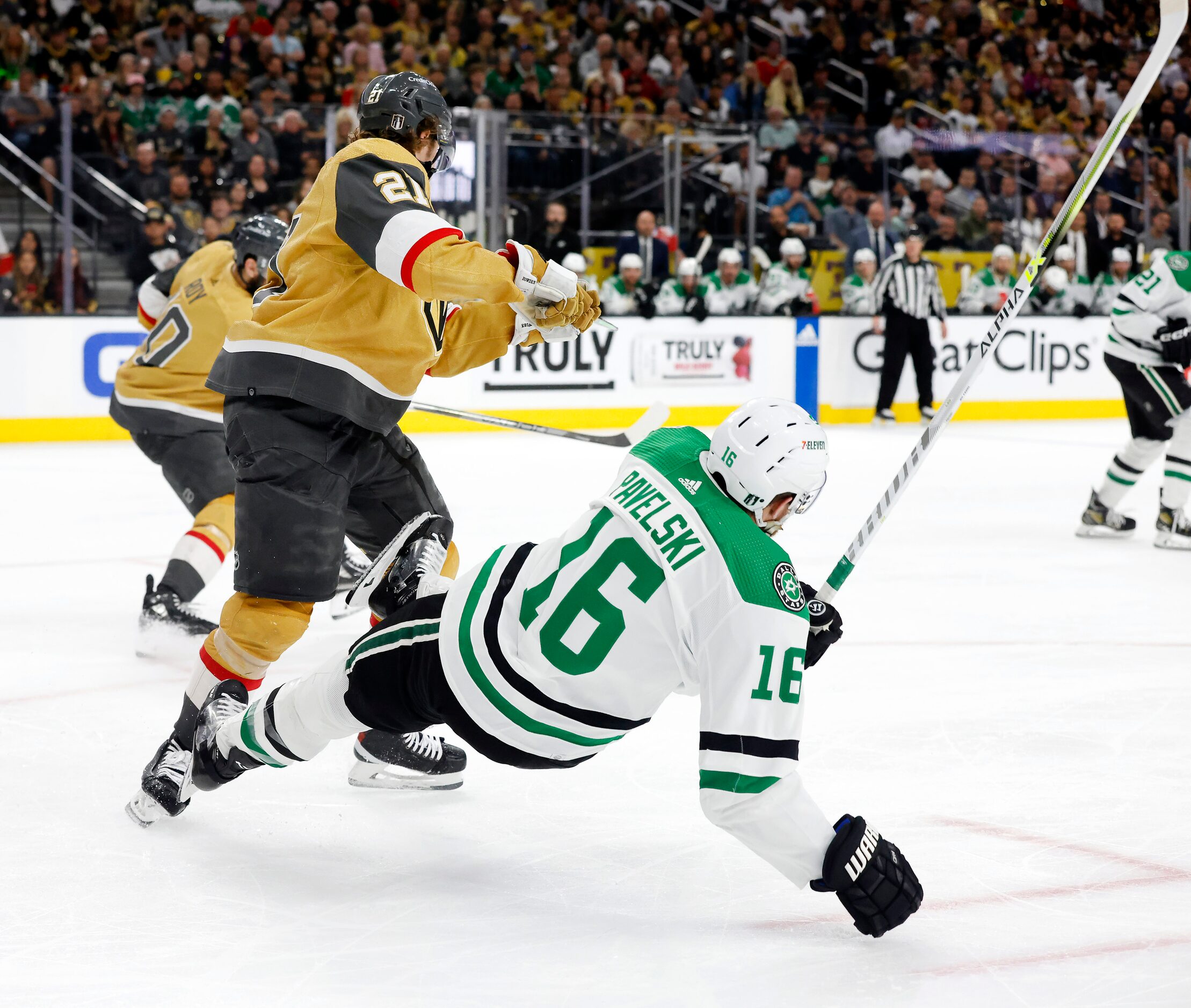 Dallas Stars center Joe Pavelski (16) is sent flying as he’s hit by Vegas Golden Knights...