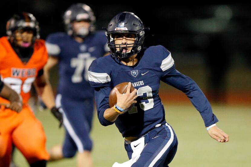 Frisco Lone Star quarterback Garrett Rangel (13) carries the ball against Lancaster during...