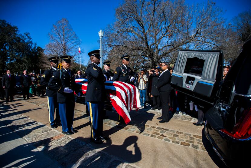 Honor guard members transport the remains of Richard Overton to his burial site the Texas...